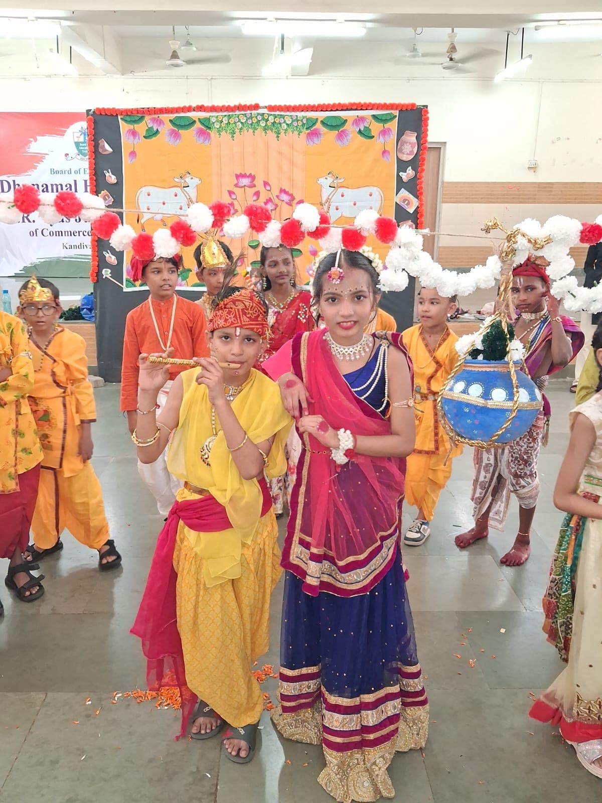 Students dressed as Krishna and Radha during a festival performance