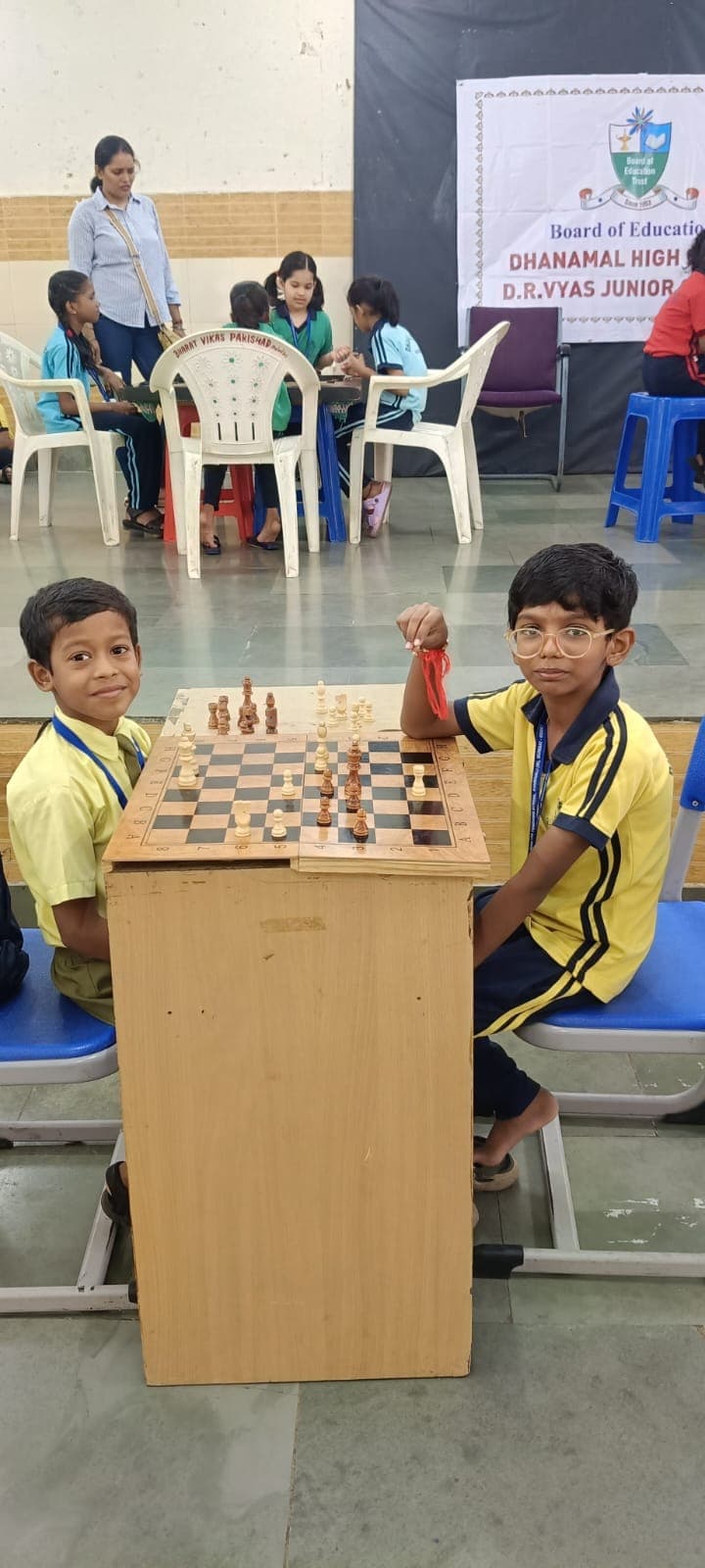 Two students playing chess during sports day