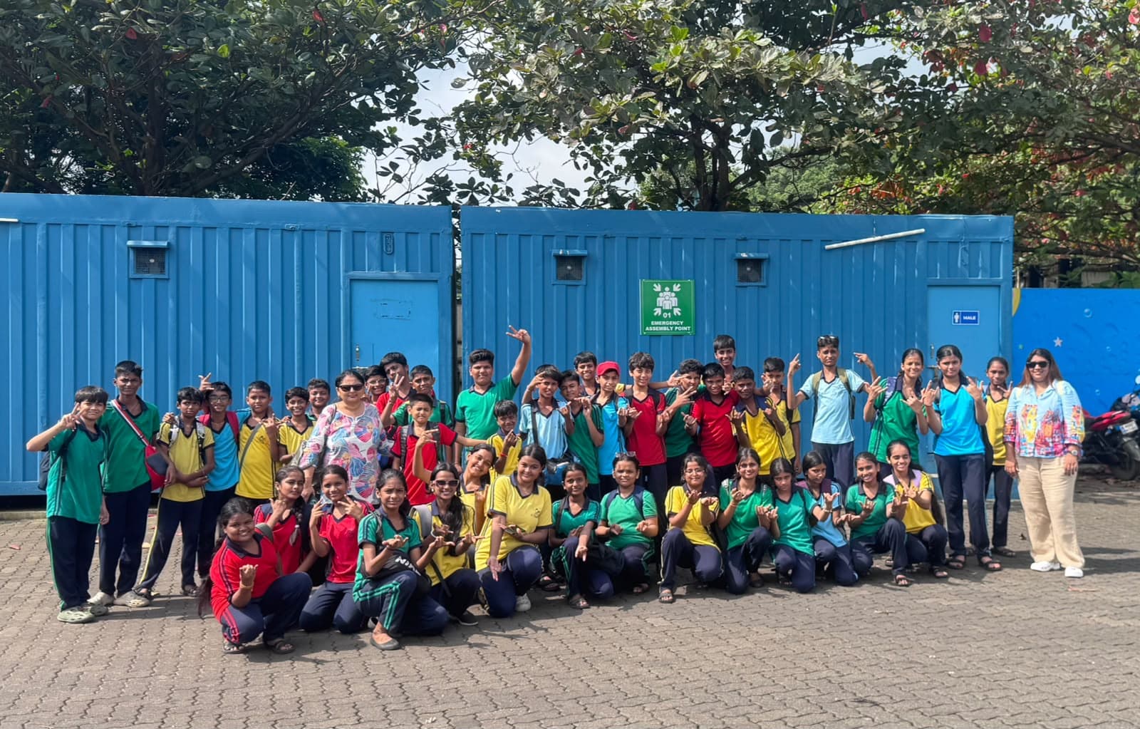 Students and teachers posing outdoors during a school trip